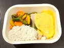 Dijonnaise fish served on rice and vegetables